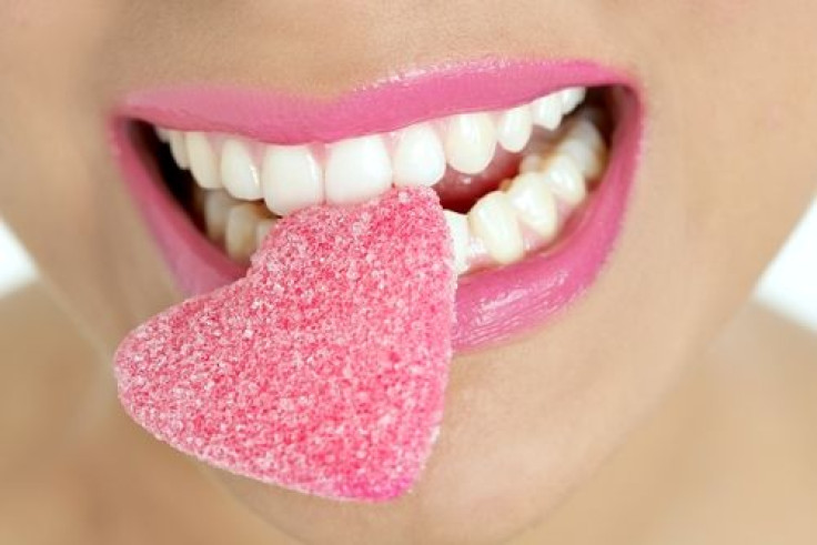 Woman with gummy candy in mouth