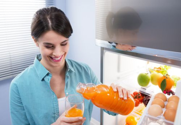 Woman pouring juice into glass