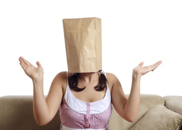 Woman wearing paper bag on head