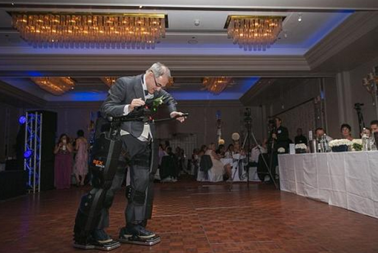 Paralyzed dad walks with exoskeleton suit to deliver wedding speech