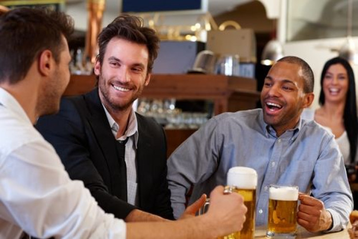 Men drinking beer and smiling