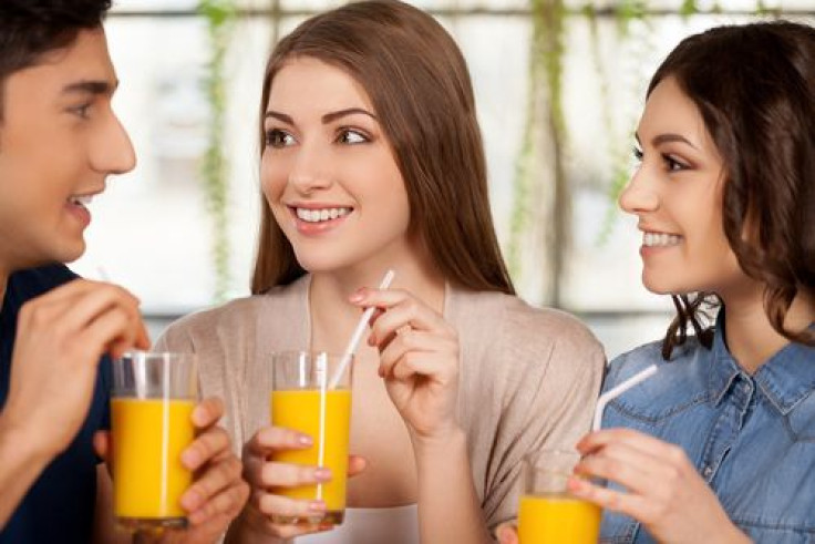 Group of friends drinking orange juice