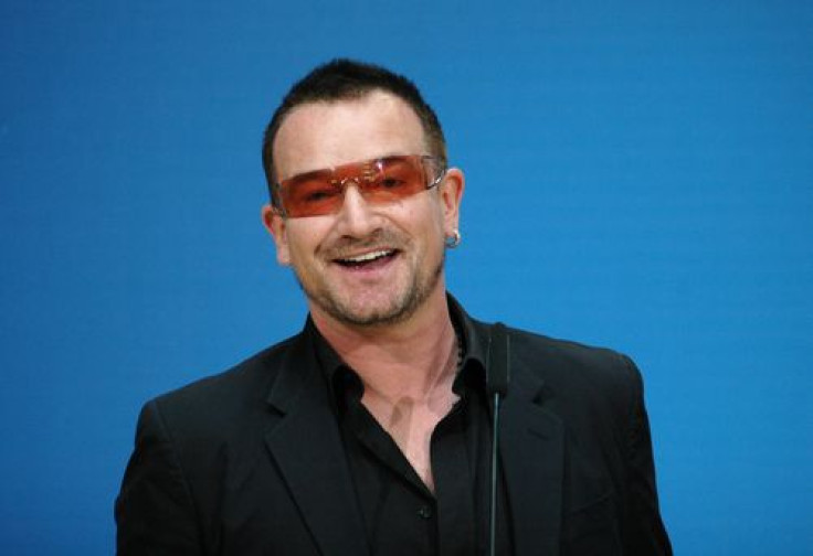 Bono smiles into the camera at a meeting with politicians of the Social Democratic Party (SPD) in Berlin