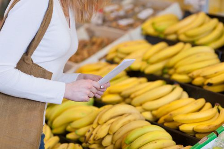Woman buying bananas at the supermarket 