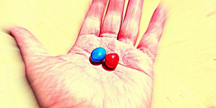 Red and blue pill on hand