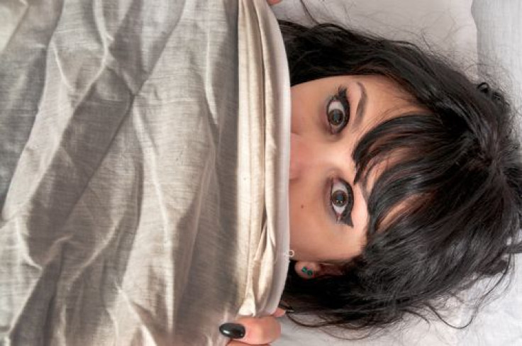 Woman waking up from a nightmare or night terror