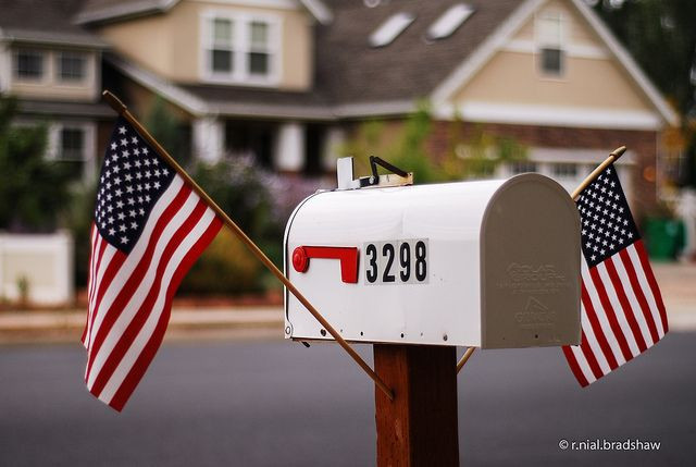 Two American flags on opposite sides of mailbox