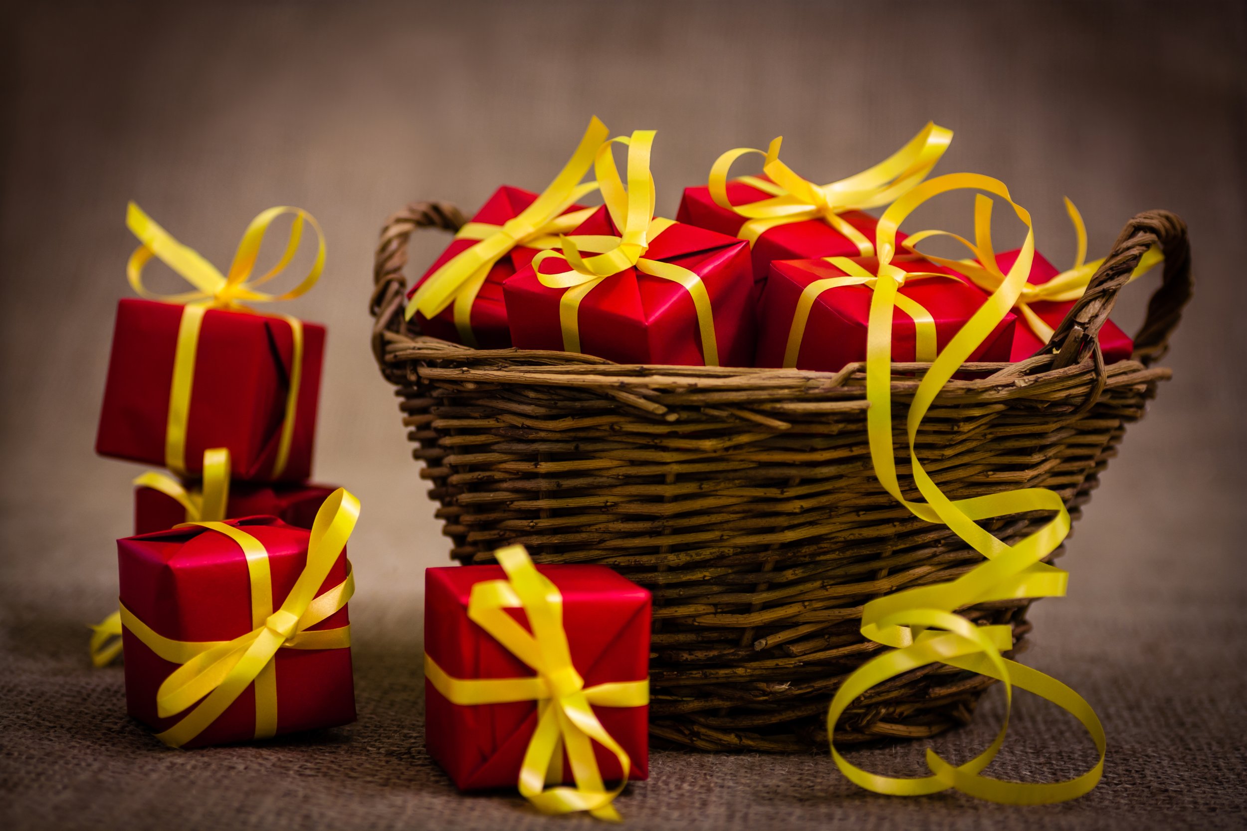 Basket full of red wrapped gifts