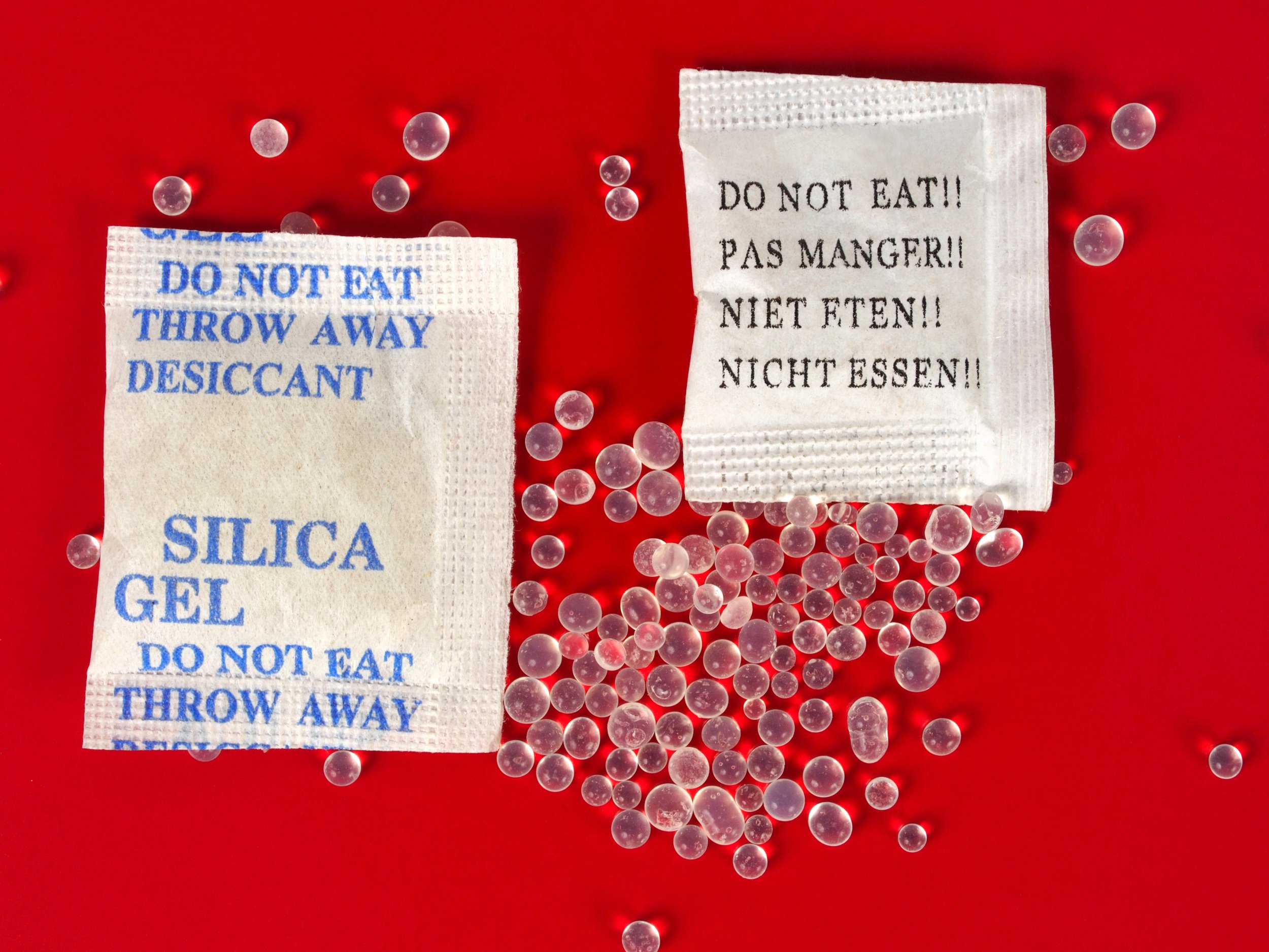 What is silica gel and why do I find little packets of it in