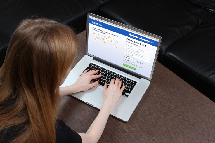 Woman logging on to Facebook