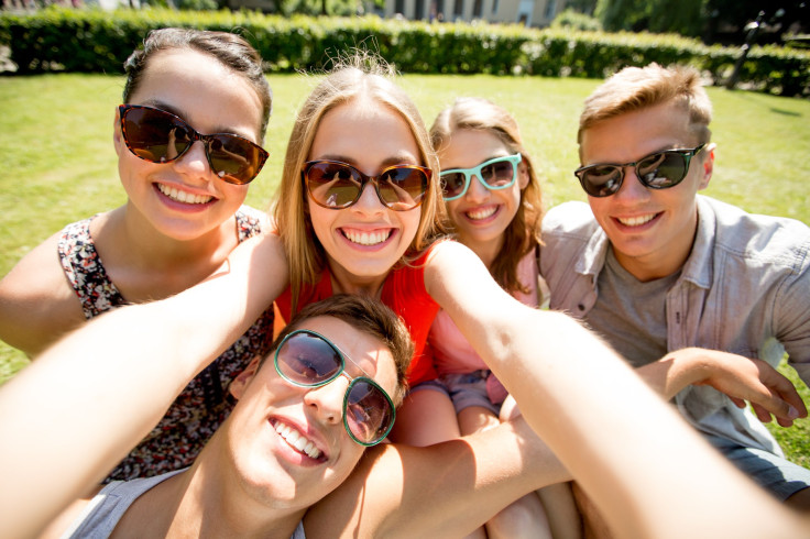 Group of friends taking a selfie at the park