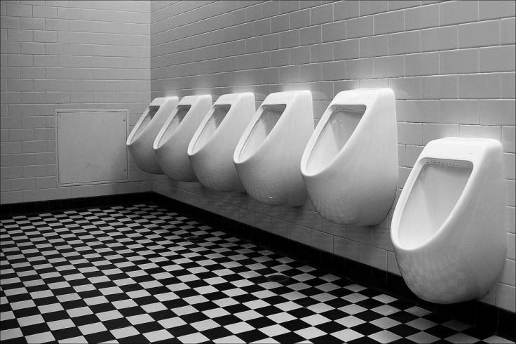 A row of urinals in bathroom