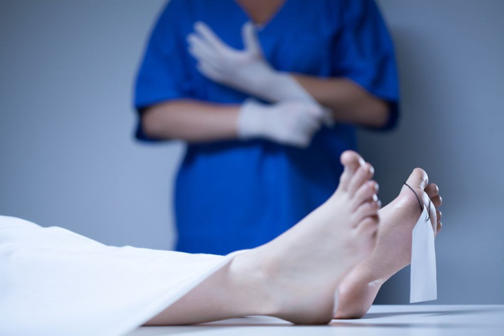 Feet with toe tag on a morgue table