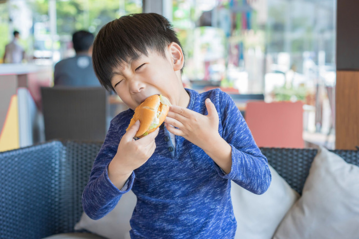 kid eating burger