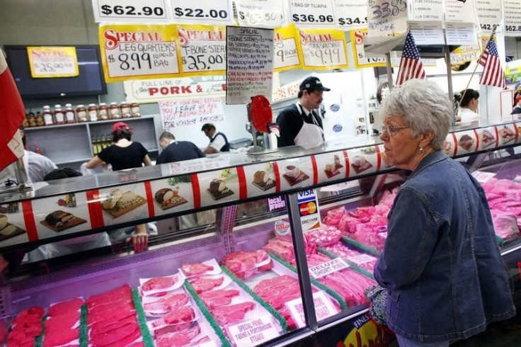A woman waits at a meat counter in the Broadway Market in Buffalo, New York April 10, 2011