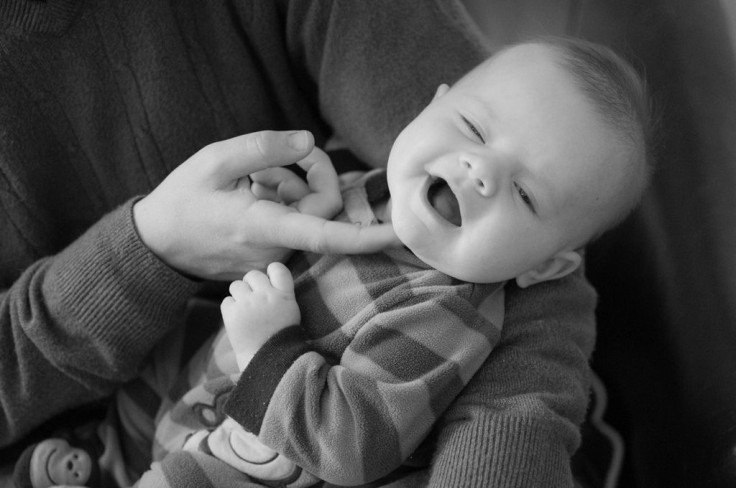 Baby getting chin tickled