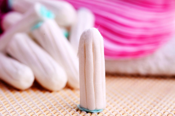 Tampon surrounded by other tampons on table