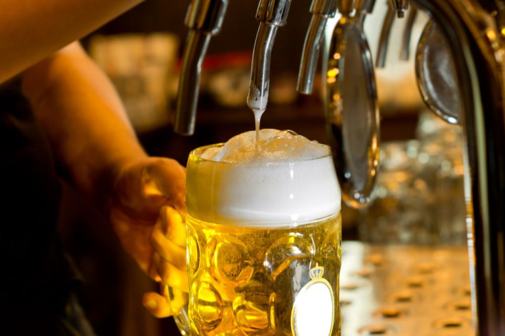 Man pouring beer into glass 