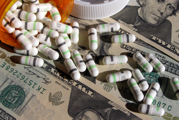 Prescription pills sprawled over money