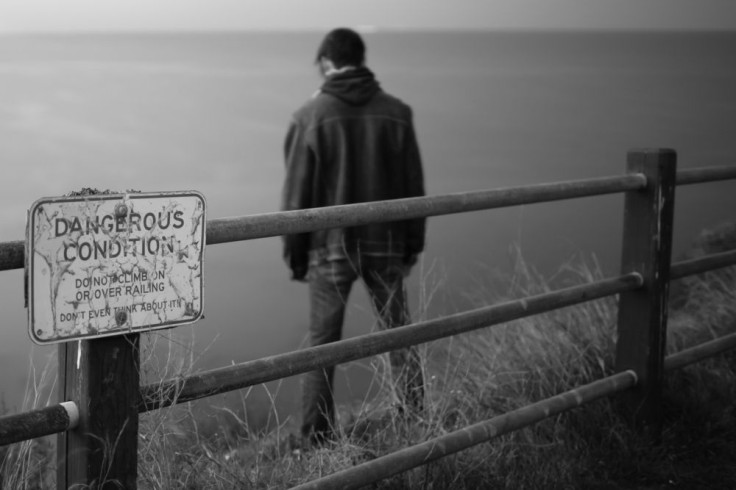 man standing by water
