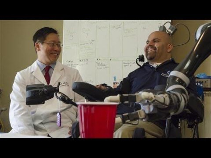 Paralyzed Man, Erik Sorto, Takes Sip Of His Beer With The Help Of Robotic Arm And Brain Implants