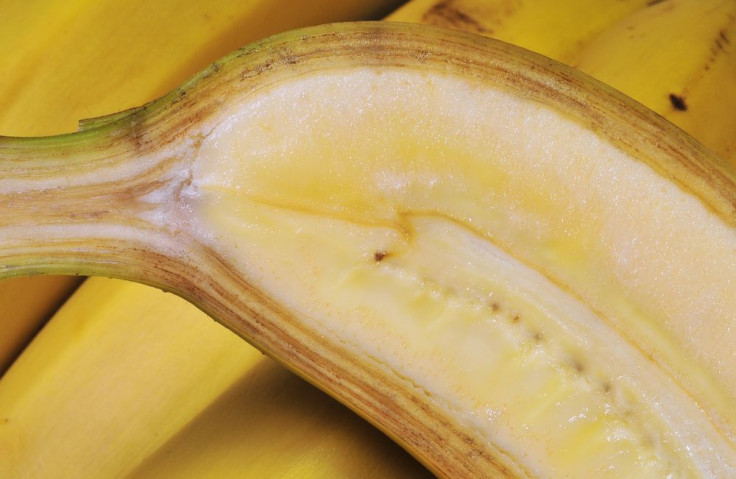 Curved banana on bananas