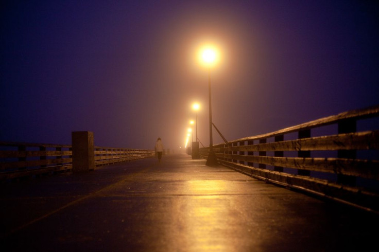 Woman walking on pier