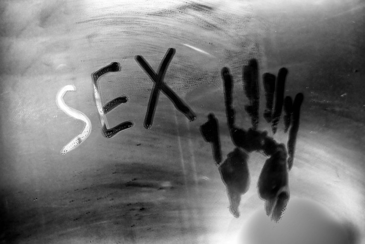 Inscription of sex on the mirror with handprint 