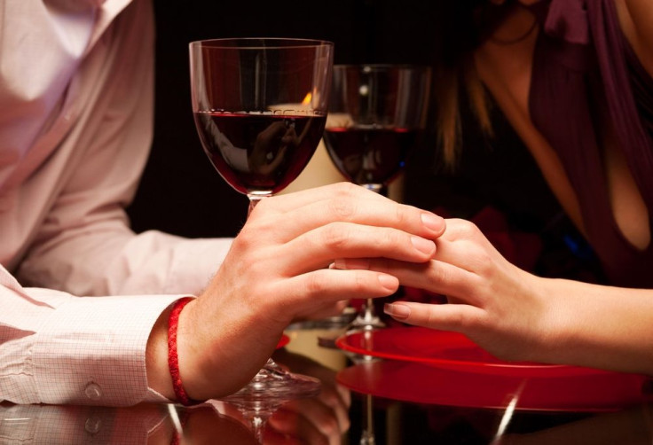 Man's fingers on table at restaurant