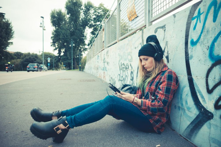 Woman listening to music on the street