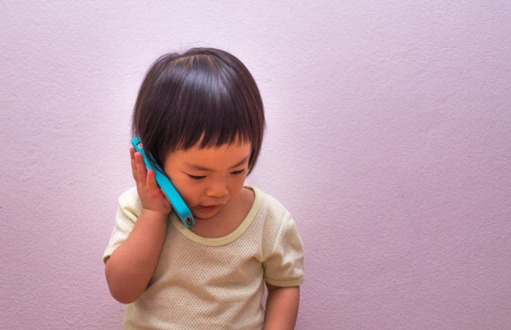 little girl on phone