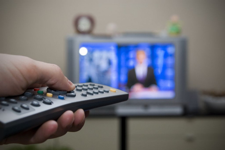 Man with TV remote