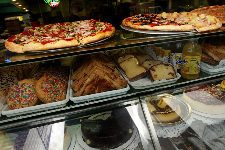 A display window of a pizzeria.  