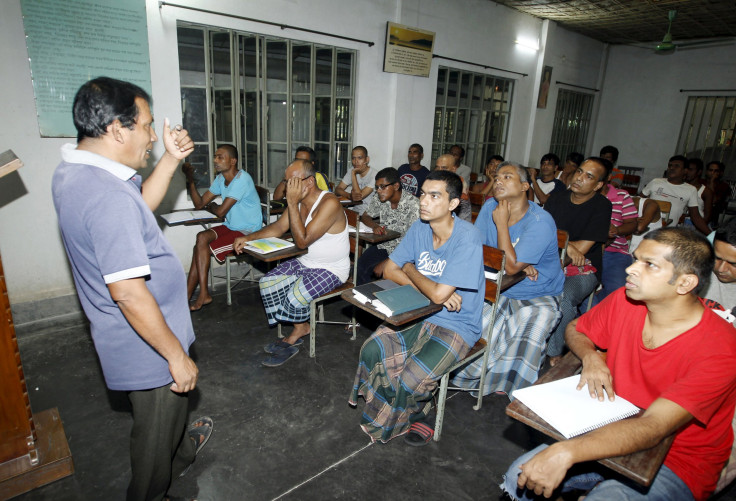 A man stands before a classroom. 