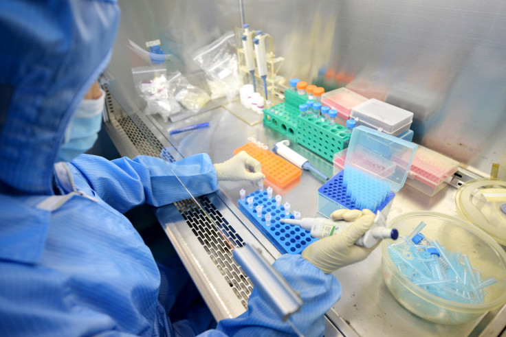 A healthcare worker tests a detection reagent of the Ebola virus. 