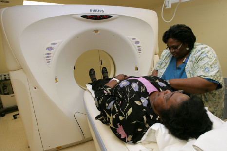 Breast cancer patient Heraleen Broome, who is participating in a clinical trial, is helped by CT Tech Sandra Davis after she had a CT scan at the UCSF Comprehensive Cancer Center August 17, 2005 in San Francisco, Calif.