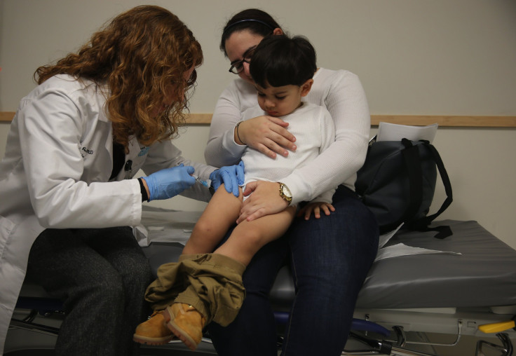 Pediatrician vaccinating child