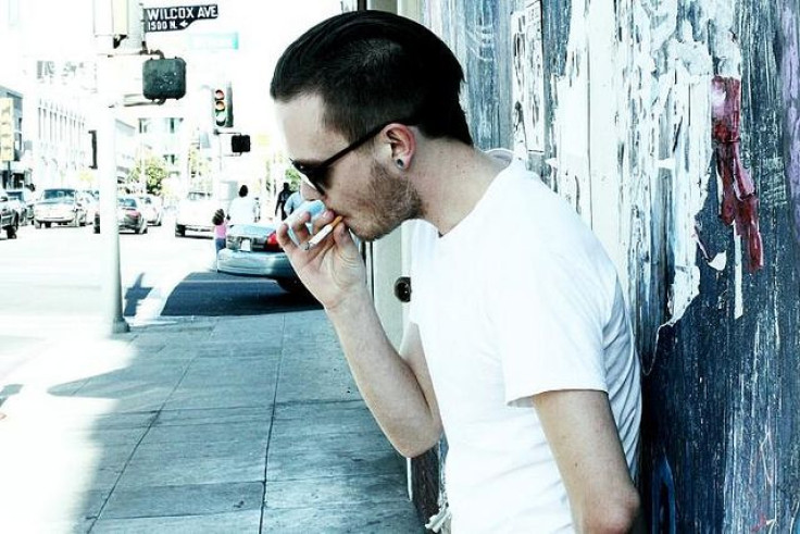 Man smoking on street