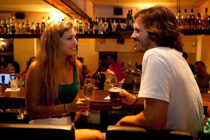 Man and woman drinking at bar