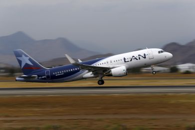 A LAN Airlines plane takes off at Santiago International Airport, Chile, January 27, 2016.