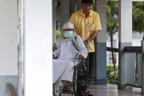 A 75-year-old Omani man who was Thailand's first MERS case sits on a wheelchair as he leaves Bamrasnaradura Infectious Diseases Institute in Nonthaburi province, on the outskirts of Bangkok, Thailand, July 3, 2015. The Omani man who became Thailand's first case of Middle East Respiratory Syndrome (MERS) has made a full recovery.