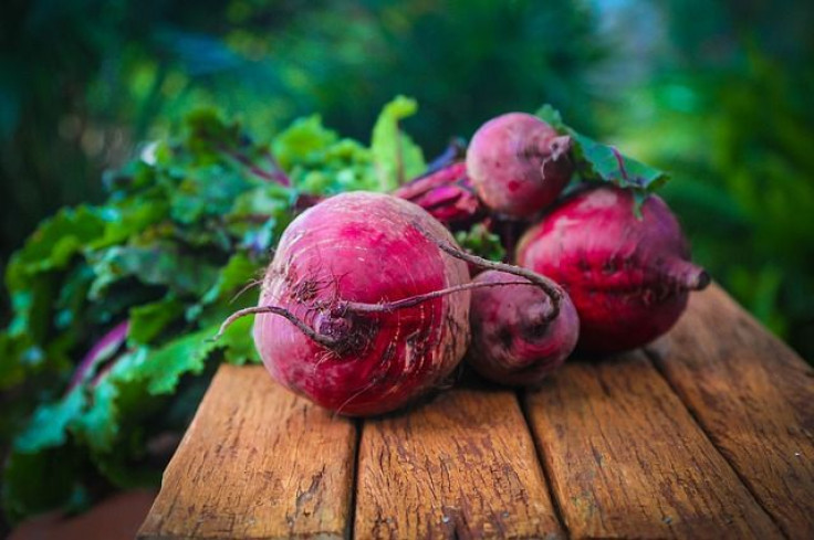 Beets on wooden surface