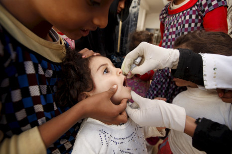 A girl receives a polio vaccination outside her house in Yemen's capital Sanaa.