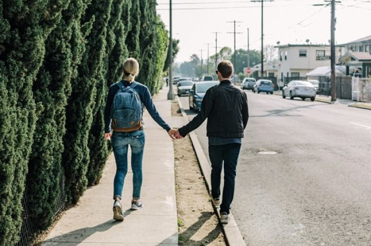 Couple holding hands