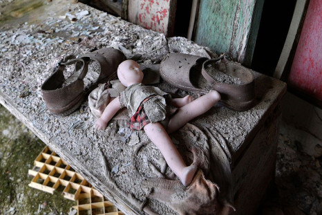 A doll and shoes lay on a bench in a nursery school of the 