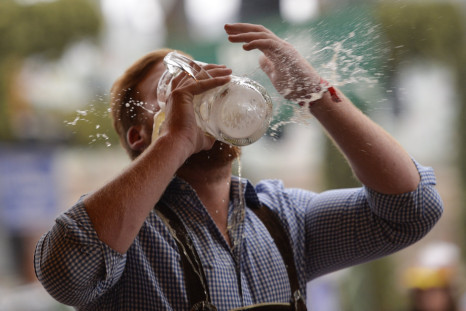 A reveller spills beer as he tries to empty his stein in one sitting at the Hofbraeu tent on the opening day of the 2015 Oktoberfest on September 19, 2015 in Munich, Germany.