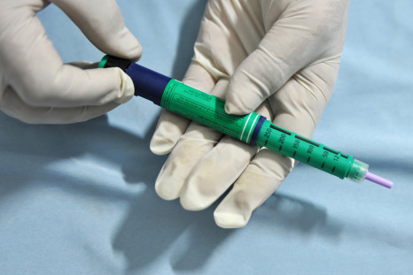 A medical assistant holds an insulin pen administered to diabetes patients. Daily, life-long insulin shots are currently the only method of treatment for Type 1 diabetes.