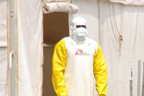 A Doctors Without Borders health worker stands in an Ebola virus treatment center in Conakry, Guinea, November 17, 2015.