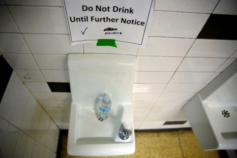 A sign is seen next to a water dispenser at North Western High School in Flint, Michigan, May 4, 2016.