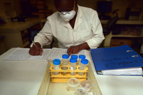 A laboratory technician logs samples in files from tuberculosis (TB) patients to be tested for TB strains at a Medecins Sans Frontieres (MSF)-run clinic in Nairobi on March 24, 2015.